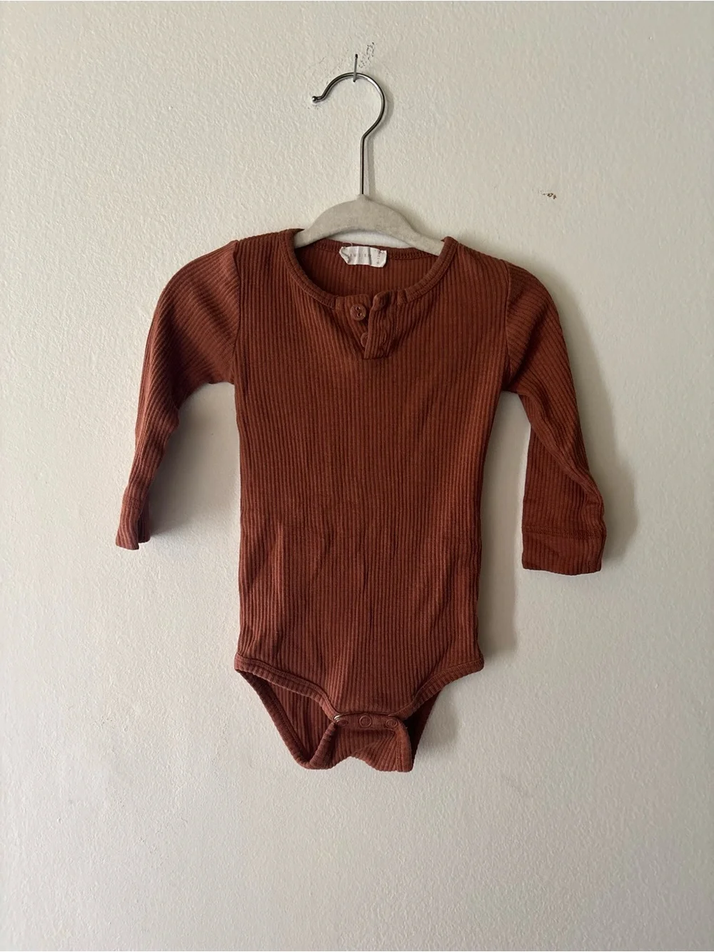 Jamie Kay Ribbed One-Piece Bodysuit in Rust Brown